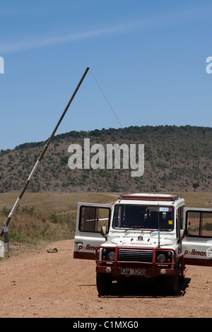 A Land Rover on safari in the Masai Mara, Kenya, Africa Stock Photo