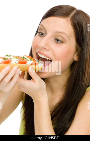Healthy lifestyle - portrait of happy woman eat caprese sandwich Stock Photo