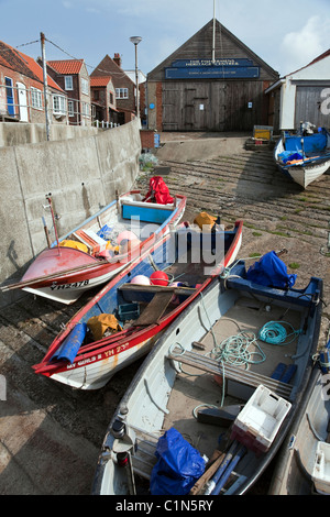 Fishing boats moored up on concrete ramp Sheringham Norfolk East Anglia England Stock Photo