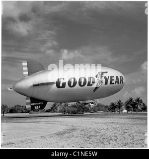 America, 1950s. View of a Goodyear tyres promotional helium gas airship moored in grassy area near Miami, Florida. Stock Photo