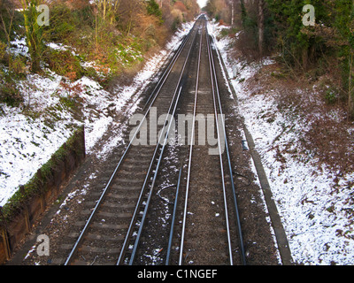 Empty railway track in winter, Epsom, Surrey, UK Stock Photo