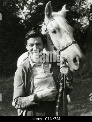 MICHAEL HOLLIDAY (1924-1963) UK pop singer at his Surrey home with the Palamino horse  Shadow he bought for his wife Shirley Stock Photo