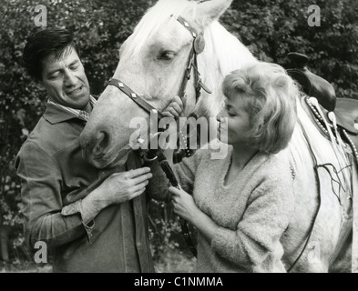 MICHAEL HOLLIDAY (1924-1963) UK pop singer with wife Shirley and Palamino horse he bought for her at their Surrey home Stock Photo