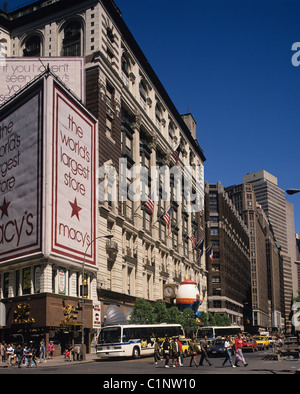 People crossing the street outside Macy's Department store. New York city, USA. Stock Photo