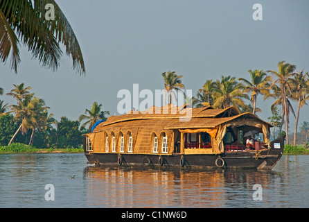 Houseboat cruising the tropical Kerala Backwaters on the Malabar coast of South India. Stock Photo