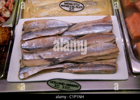 Herring Fillets in various sauces, Russ & Daughters, New York City.  179 East Houston Street, NY, NY 10002, Appetizers Stock Photo