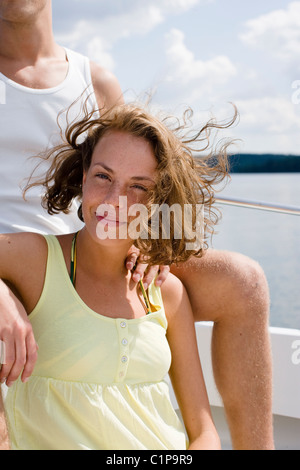 Portrait of woman relaxing in boat on sea Stock Photo