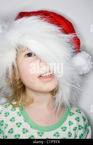 Studio portrait of girl wearing santa hat Stock Photo