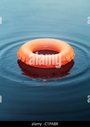 Inflatable ring floating on water Stock Photo