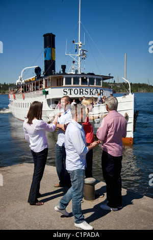 People standing on jetty Stock Photo
