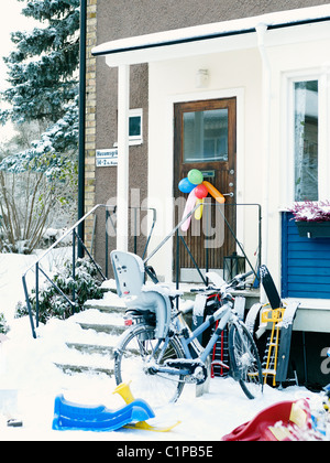 Colorful balloons hanging on door Stock Photo