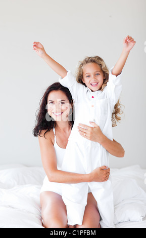 Attentive mother hugging her daughter Stock Photo