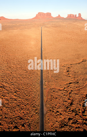 AERIAL VIEW. Monument Valley. Road 163 heading north towards Mexican Hat. Navajo Indian land, Arizona / Utah border, USA. Stock Photo