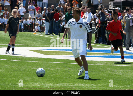 David Beckham joins former Real Madrid teammate Zinedine Zidane to celebrate the opening of the start of the American league's Stock Photo