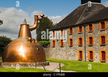 Republic of Ireland, County Cork, Old Midleton Distillery, Copper pot still outside distillery building Stock Photo