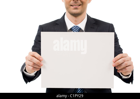 Image of male hand holding blank paper while advertising something Stock Photo