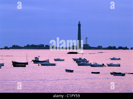 Sunset over boats and Phare de la Vierge Lighthouse. Stock Photo