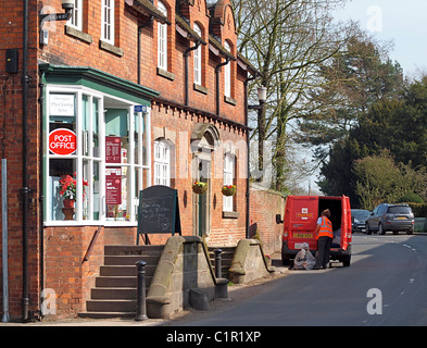 Royal Mail collection of post from a small village Post Office Stock Photo