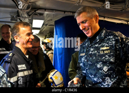 adm. Samuel J. Locklear, III, commander, Joint Task Force Odyssey Dawn, speaks with French navy Rear Adm. Philippe Coindreau, Stock Photo