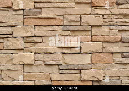 Grunge ocher  exterior textured surface of brick wall Stock Photo