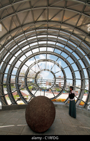 A pre-columbian stone sphere is displayed in a spherical building outside the Museo Nacional de Costa Rica in San Jose Stock Photo