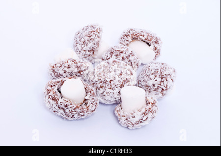 A selection of coconut mushrooms traditional sweets on a white background Stock Photo