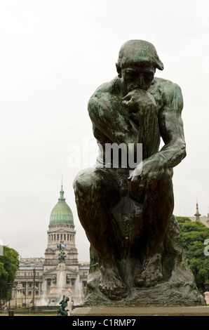 Statue of thinking man (The Thinker) with Congress Palace behind, Buenos Aires, Argentina Stock Photo