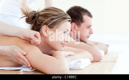 Attractive young couple having an acupunctre therapy Stock Photo