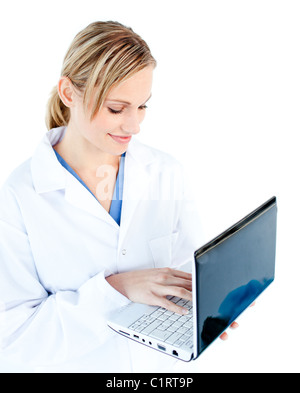 Self-assured female doctor holding a laptop Stock Photo