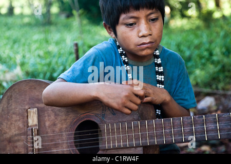 Argentina Guarani Mbya Misiones San ignacio art build carving craft craftsmanship culture forest guitar hand-made indian indigen Stock Photo