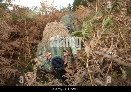 A British Army sniper team dressed in ghillie suits. Stock Photo