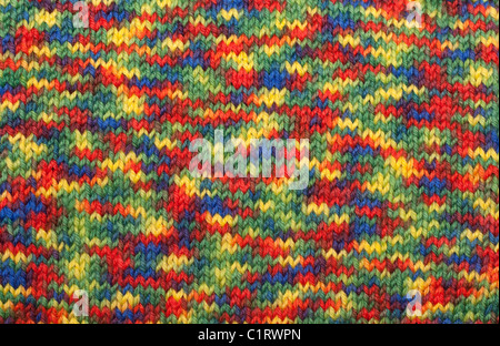 Varicoloured knitted manually from woolly threads background Stock Photo