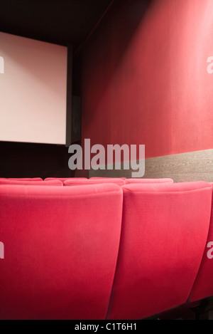 back view of empty red velvet seats in movie theater Stock Photo - Alamy