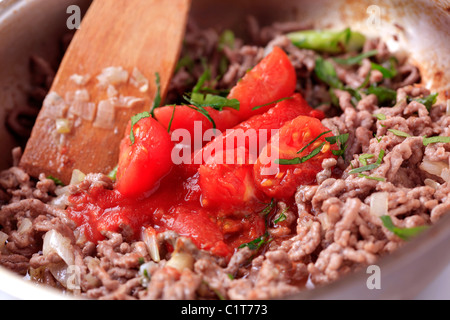 Preparing ragu alla Bolognese in a pan - detail Stock Photo