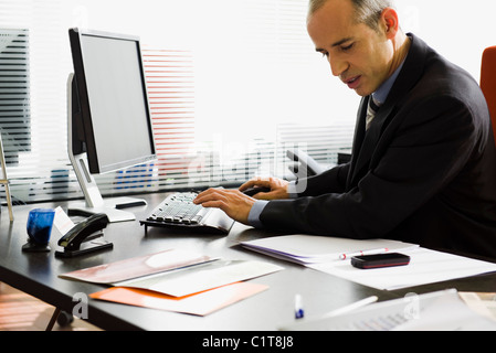 Executive using desktop computer Stock Photo