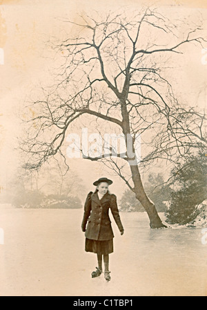 Historical photograph taken in  January 1895 of girl on ice skates on pond near Castleton Derbyshire England UK Stock Photo