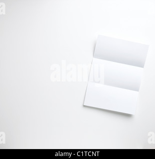 a sheet of blank folded letter paper copyspace on a white background ready for your copy Stock Photo