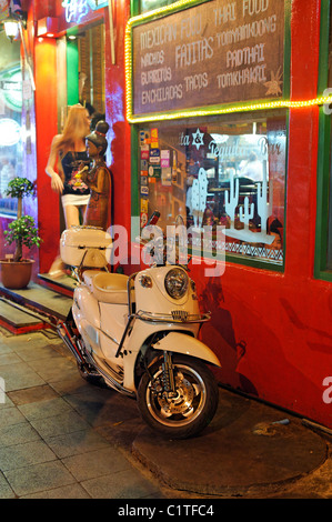 Girl and Moped - Patpong, Bangkok Stock Photo