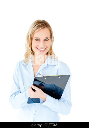 Assertive businesswoman taking notes on a clipboard Stock Photo