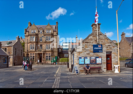 Stromness harbour area with lifeboats office and The Stromness Hotel on Orkney Mainland in Scotland Stock Photo
