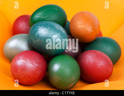Easter dyed egg put by heap on orange napkin Stock Photo