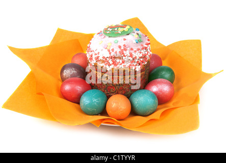 Easter pie in glaze and dyed egg on orange napkin insulated on white background Stock Photo
