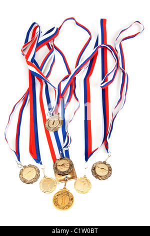 Golden medals with tape on white background Stock Photo