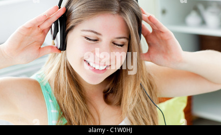 Young woman listening to music with headphones Stock Photo