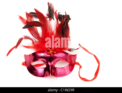 Red mask with feathers on a white background Stock Photo