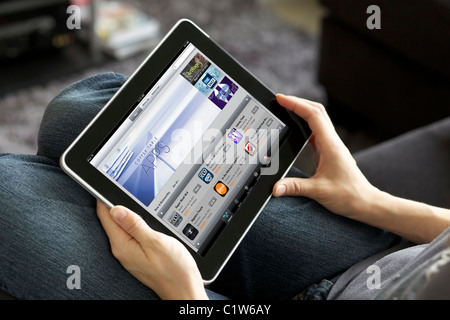 Close up view of a woman checking stock market with Bloomberg finance application on her iPad Stock Photo