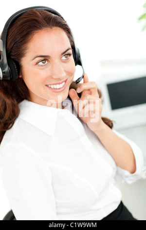 Bright woman with headset working in a customer service Stock Photo