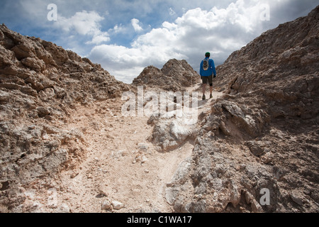 Runner hiking along the White Mesa Bike Trails Area - Ojito Wilderness - New Mexico. Stock Photo