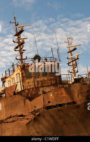 Mauritania, Nouadhibou, Ship wrecks rusting on shores of beach of Nouadhibou, one of the largest ship wreck cemeteries worldwide Stock Photo