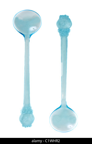 Two blue transparent plastic spoons on white background Stock Photo